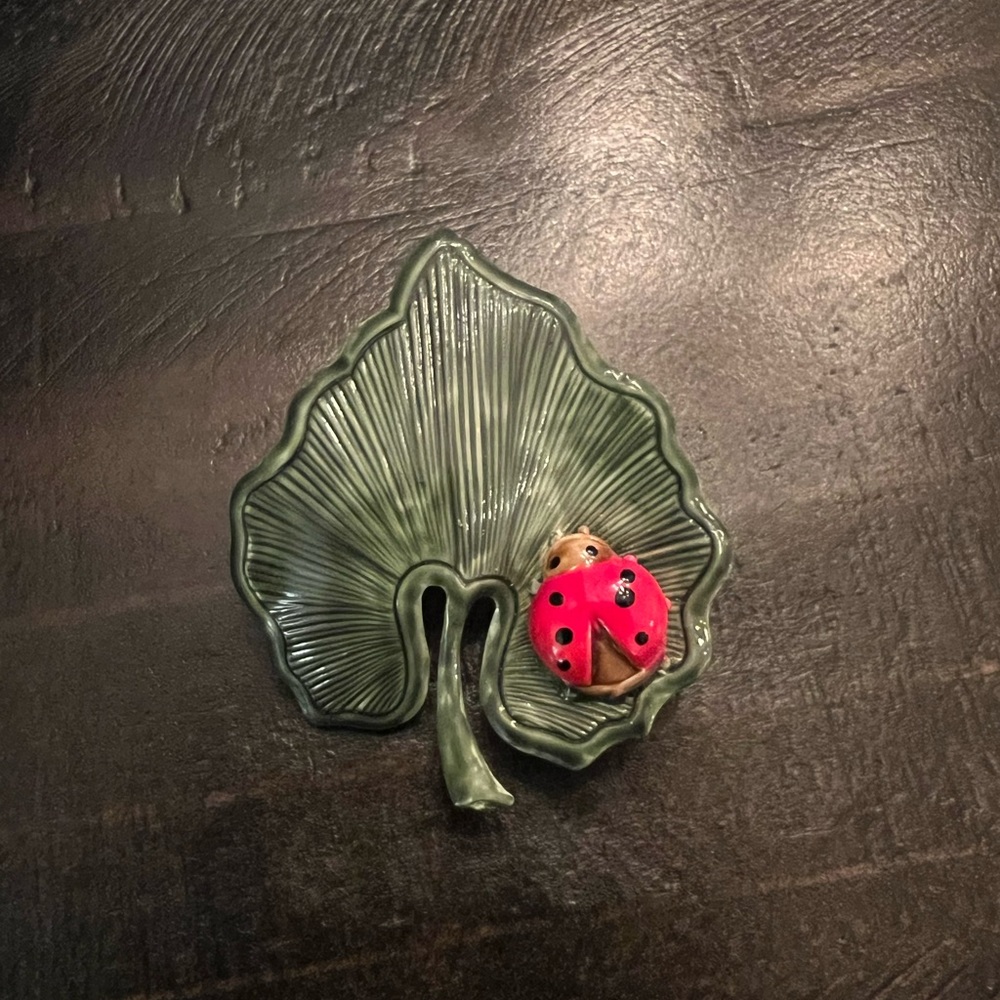 One of a kind Robert Greene lady bug on a leaf brooch.